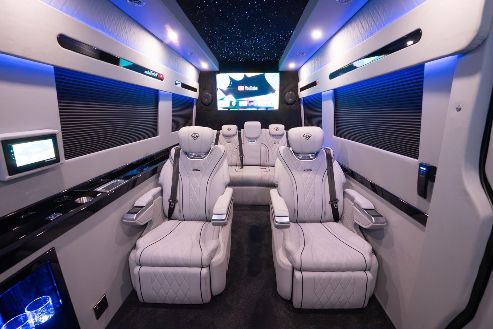 D-Luxe Sprinter cream leather seating, blue cabin lighting and star-effect ceiling